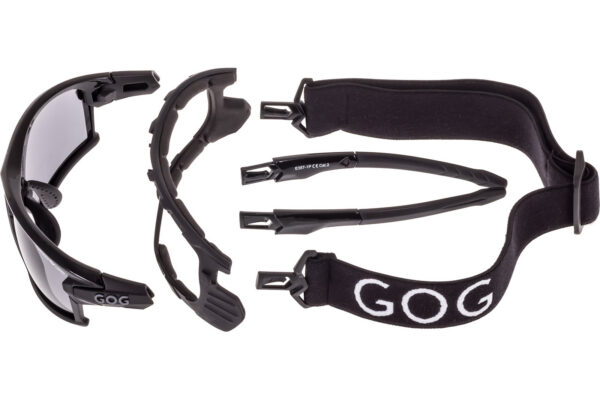 Pair of black protective goggles with interchangeable lenses and a wide Velcro strap marked 'GOG' for secure fit.