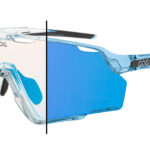 GOG safety glasses with a clear left lens and blue mirrored right lens, divided by a vertical line.
