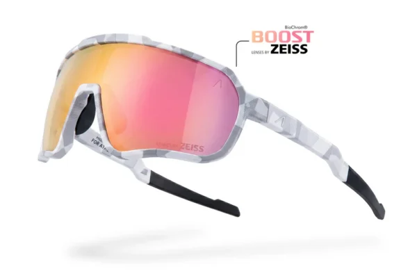 Snow goggles with a white patterned frame and pink-orange mirrored lenses, ZEISS branding, floating mid-air with a strap extending outward.