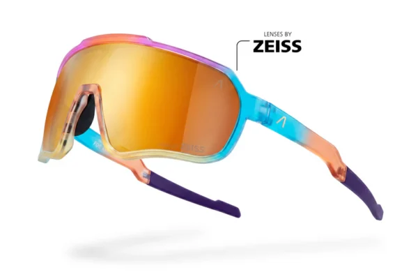 Colorful ZEISS ski goggles with orange mirrored lens and blue-to-purple frame, floating with a shadow.