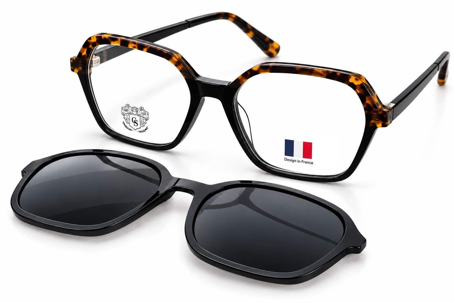 Two pairs of eyewear on a white background: tortoise-shell frame reading glasses and black sunglasses with dark lenses