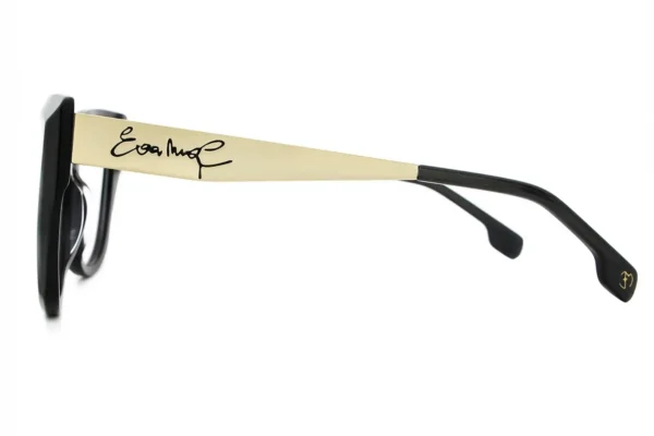 Side view of black sunglasses with a gold metal arm bearing a signature.