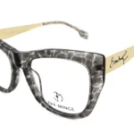 Oversized tortoiseshell eyeglasses with thick frame and beige signature-etched temples (Eva Minge).