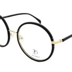 Round black and gold eyeglasses with thin frames and clear lenses (Eva Minge)