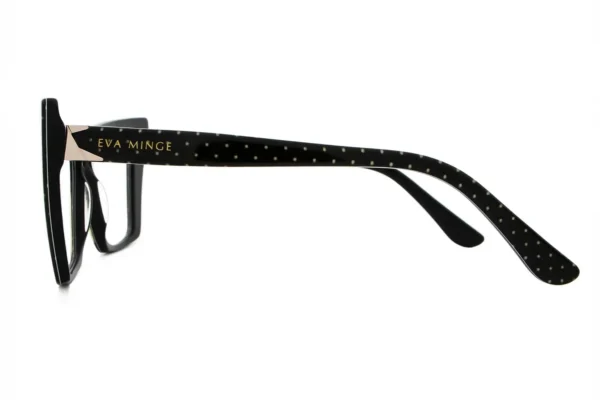 Black eyeglasses with dotted temples and a gold Eva Minge logo on the arm (side view).