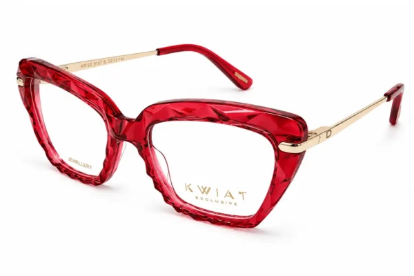 Red translucent eyeglasses with diamond-cut frames and gold-tone temples; bold fashion eyewear
